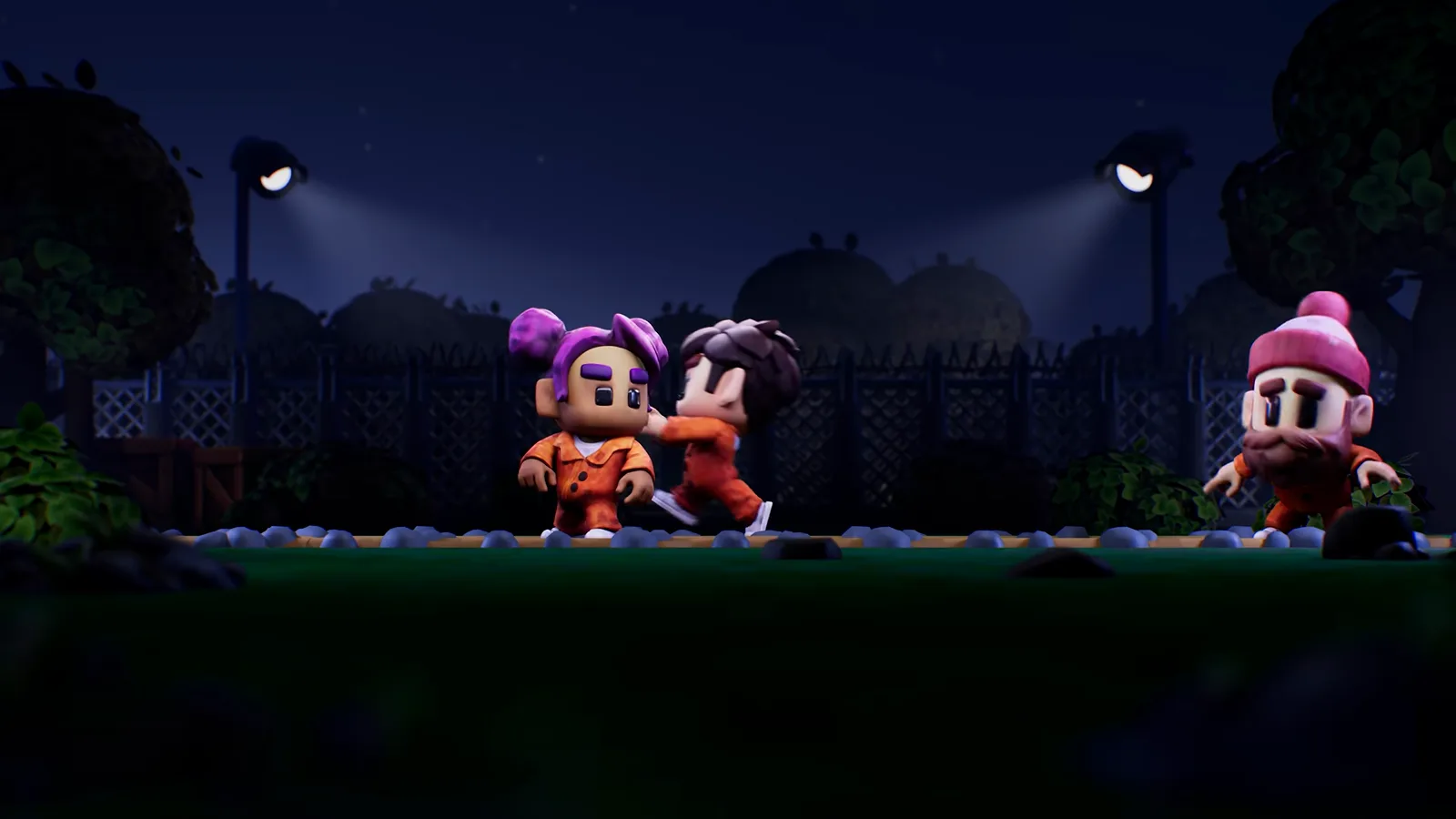 The Escapists 3 night trailer frame of three inmates with purple pigtail buns, brown hair and a pink bobble hat walking a fence line under floodlights