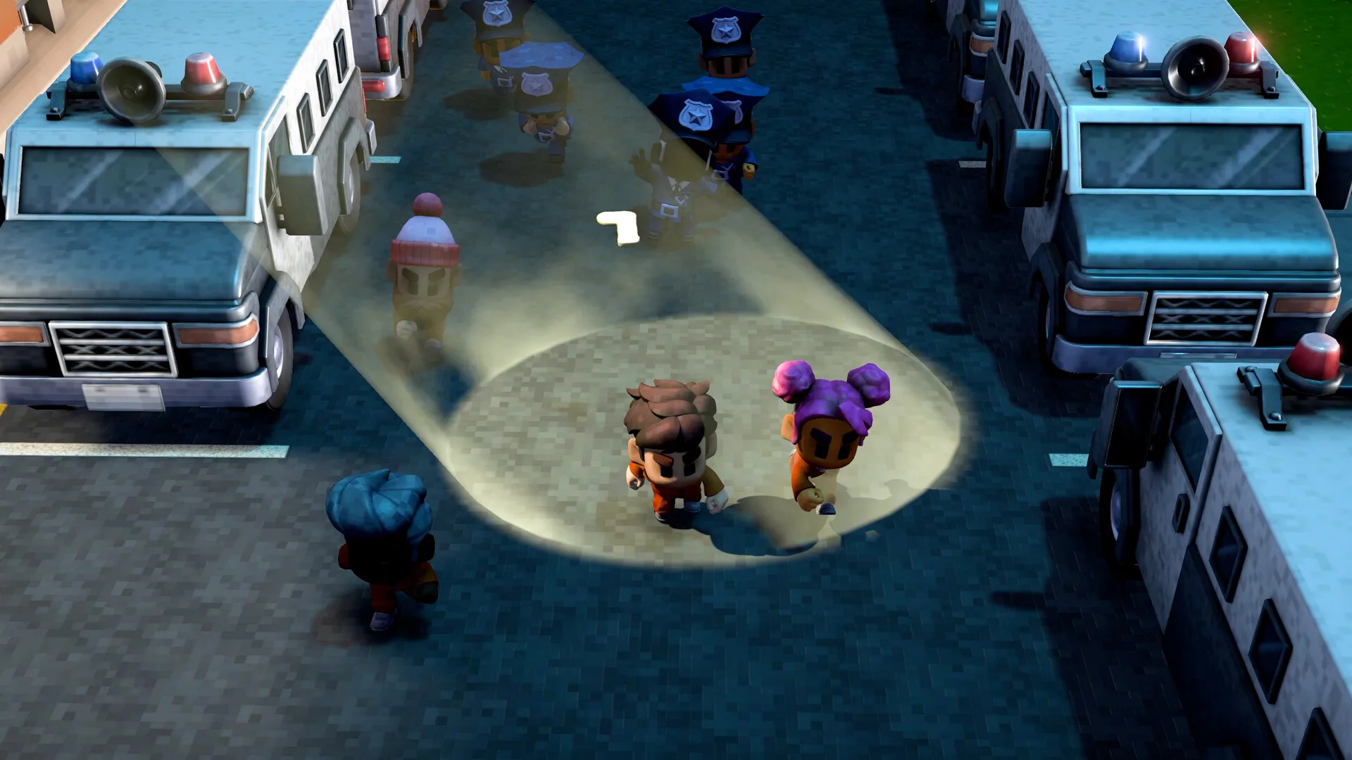 Official The Escapists 3 screenshot showing two inmates in orange jumpsuits caught in a searchlight beam on a dark street at night while being pursued