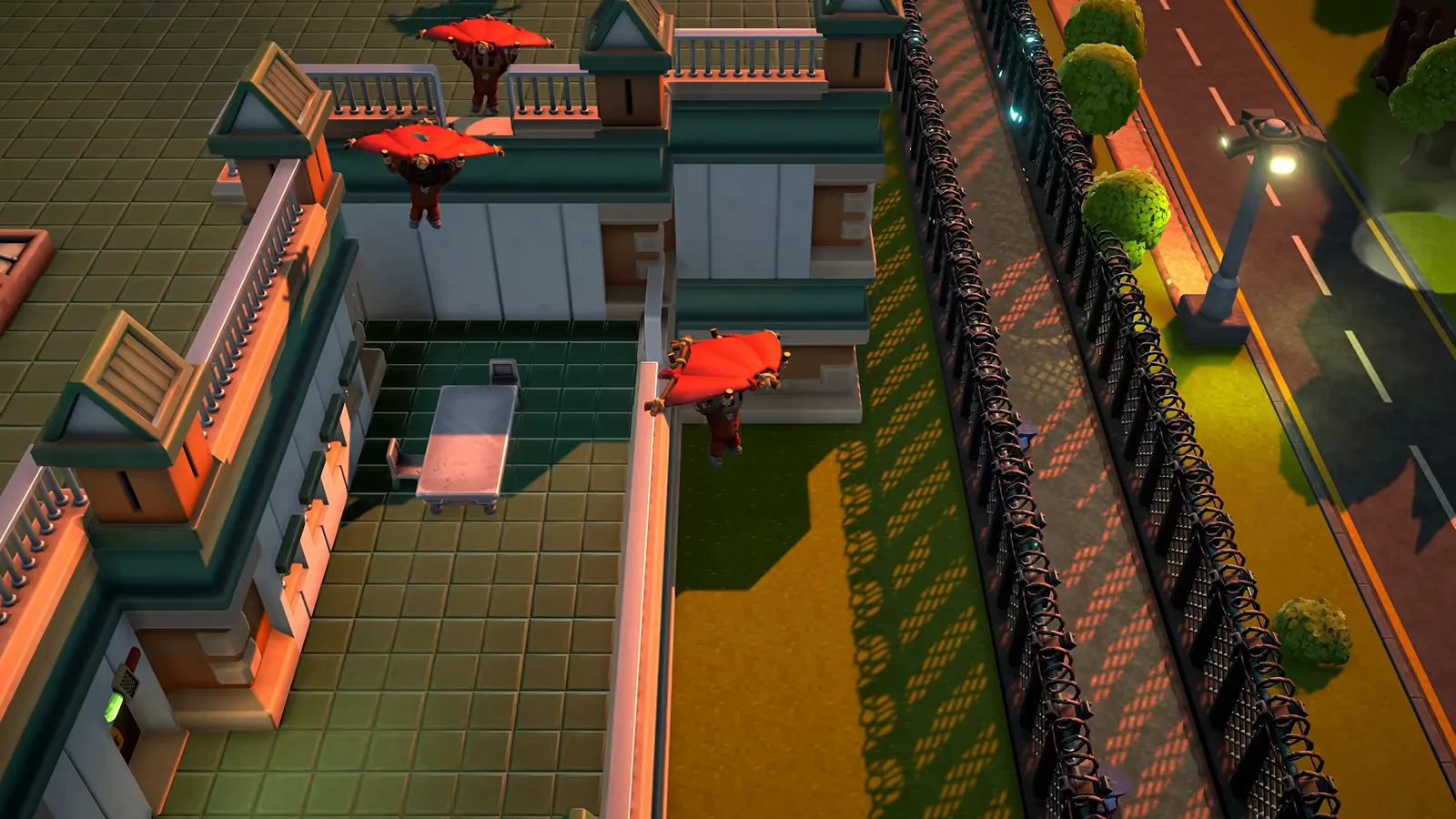 Three inmates glide off a prison roof and over the outer wall on improvised red blanket wings in The Escapists 3 trailer.